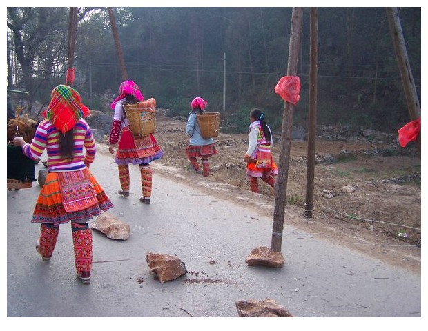 Women with baskets, Yunnan, China