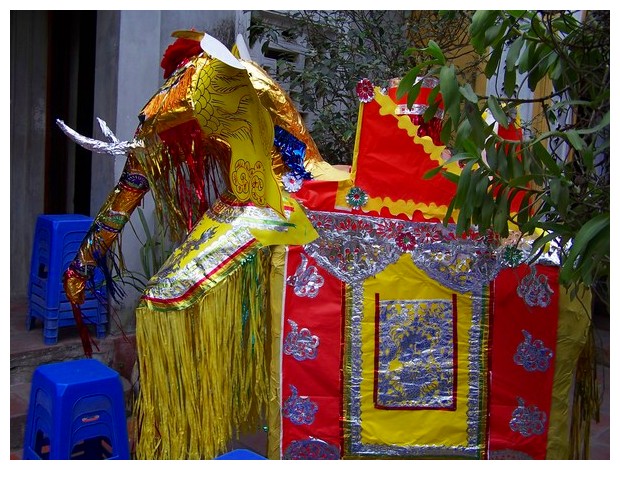 Vietnam - paper elephant, horse and dragon offered to ancestors in buddhist temple