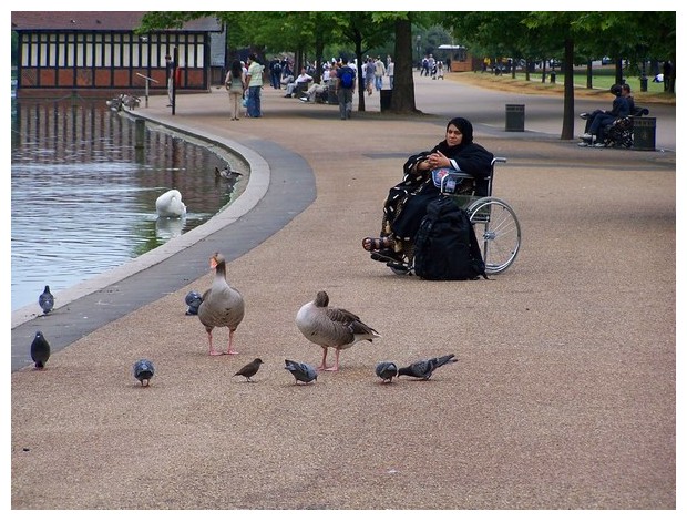 Muslim woman on wheel chair, London