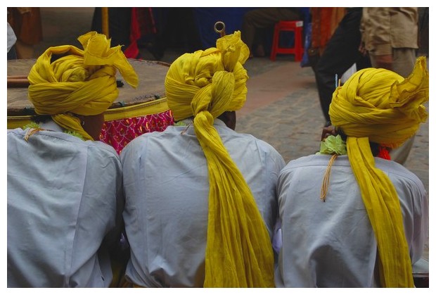 Guys wearing yellow turbans in Dilli Haat, Delhi, India