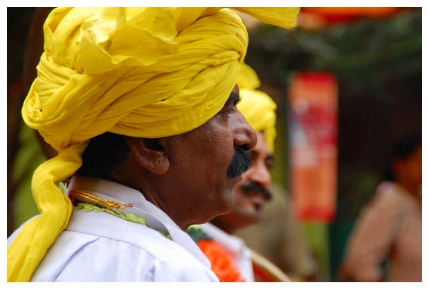 Guys wearing yellow turbans in Dilli Haat, Delhi, India