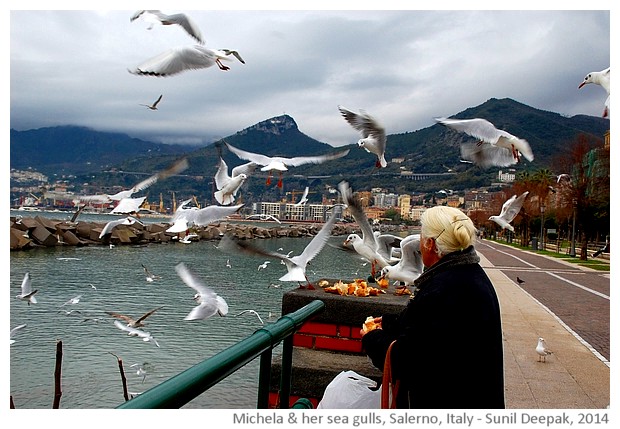 Michela giving bread to seagulls, Salerno, Italy - images by Sunil Deepak, 2014