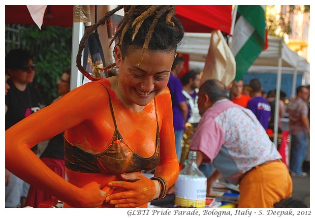 Saffron coloured stilt dancer, Bologna GLBTI pride parade - S. Deepak, 2012