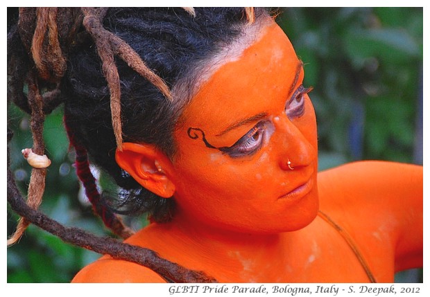 Saffron coloured stilt dancer, Bologna GLBTI pride parade - S. Deepak, 2012