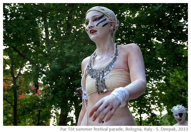 Stilt dancers in white colour, Par Tòt parade, Bologna, Italy - images by Sunil Deepak, 2013