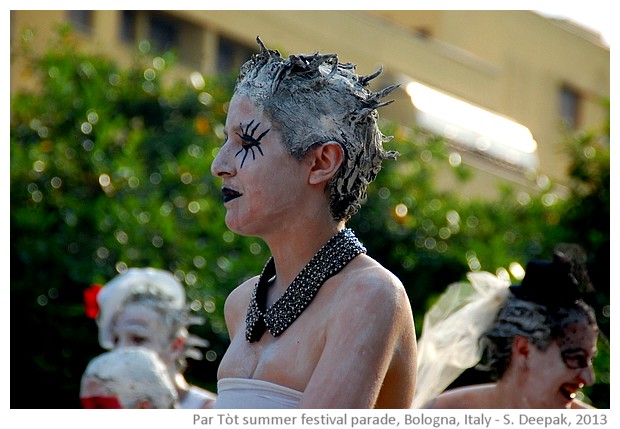 Stilt dancers in white colour, Par Tòt parade, Bologna, Italy - images by Sunil Deepak, 2013