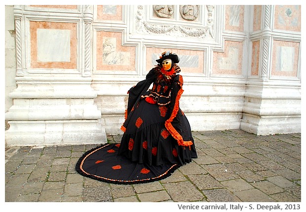 Orange and black costume at Venice carnival, Italy - S. Deepak, 2013