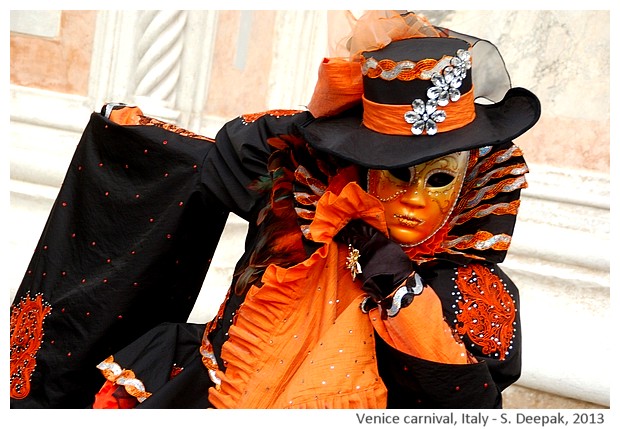 Orange and black costume at Venice carnival, Italy - S. Deepak, 2013