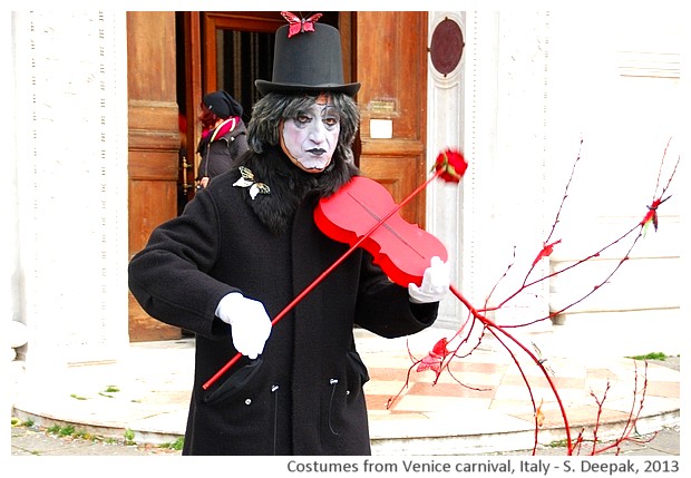 Man with red violin, Carnival, Venice, Italy - S. Deepak, 2013