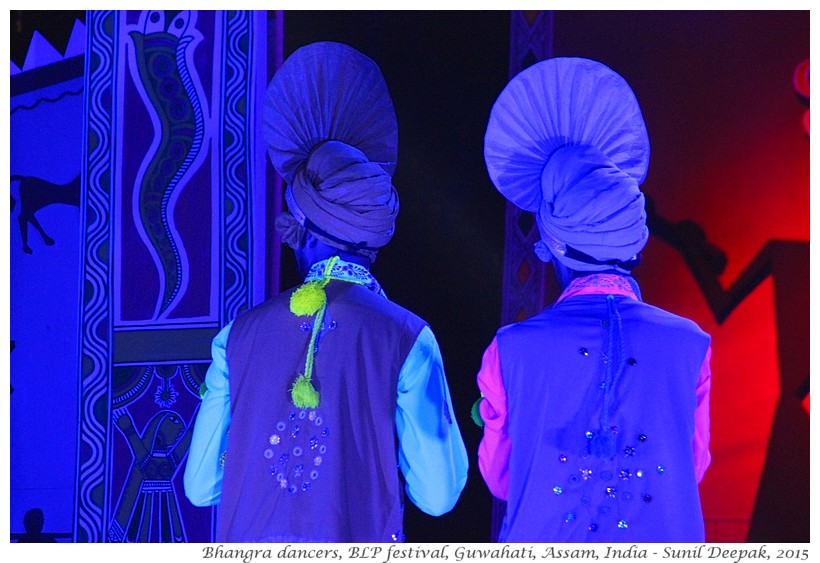 Folk dancers in blue light, Guwahati, Assam, India - Images by Sunil Deepak