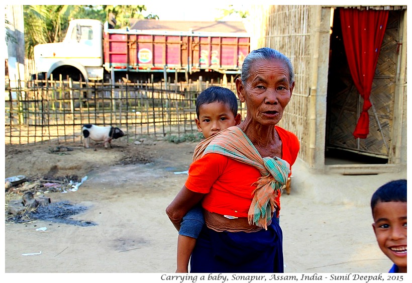 Grand-Mother carrying a baby, Assam, India - Images by Sunil Deepak