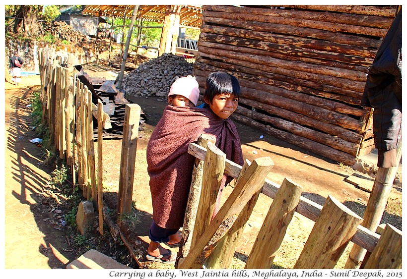 Sister carrying a baby, Meghalaya, India - Images by Sunil Deepak