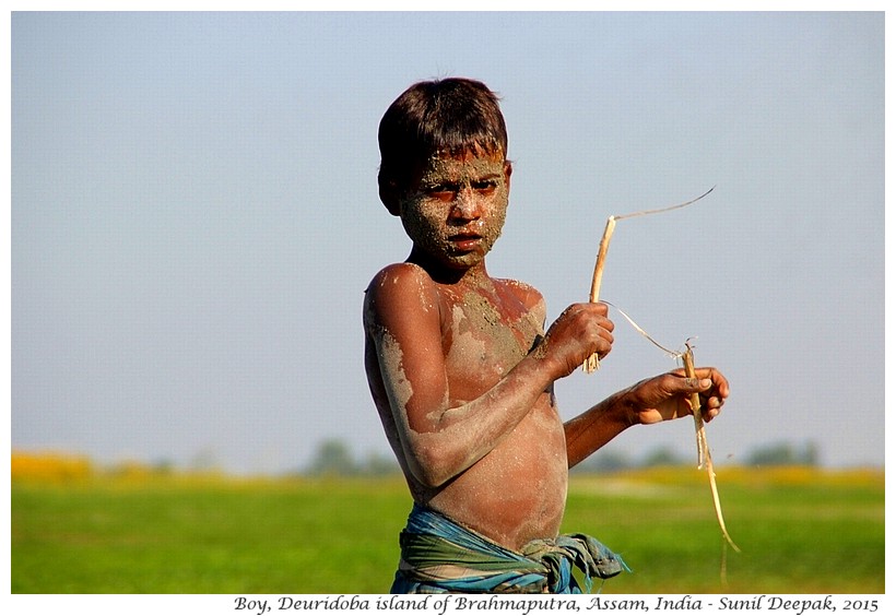 Boy on Brahmaputra's island, Assam, India - Images by Sunil Deepak