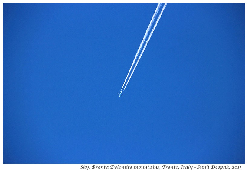 Airplane fumes in the sky, Trento, Italy - Images by Sunil Deepak